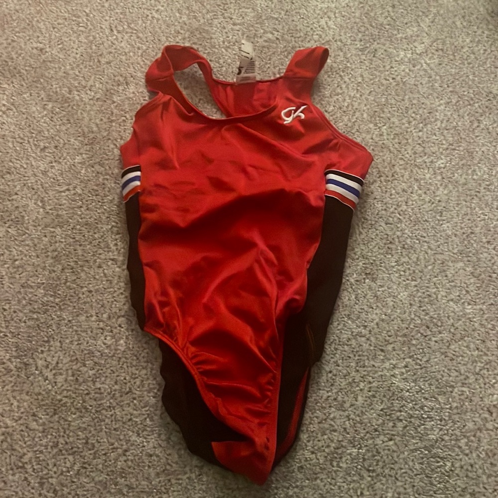 GK red and black leo with red white and blue stripes on back